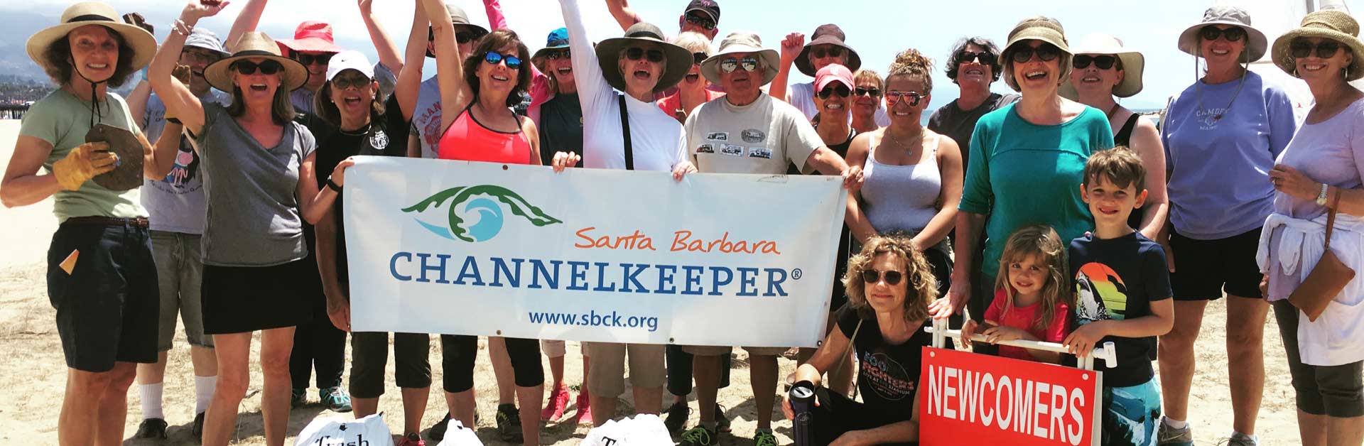 Happy beach cleanup volunteers.