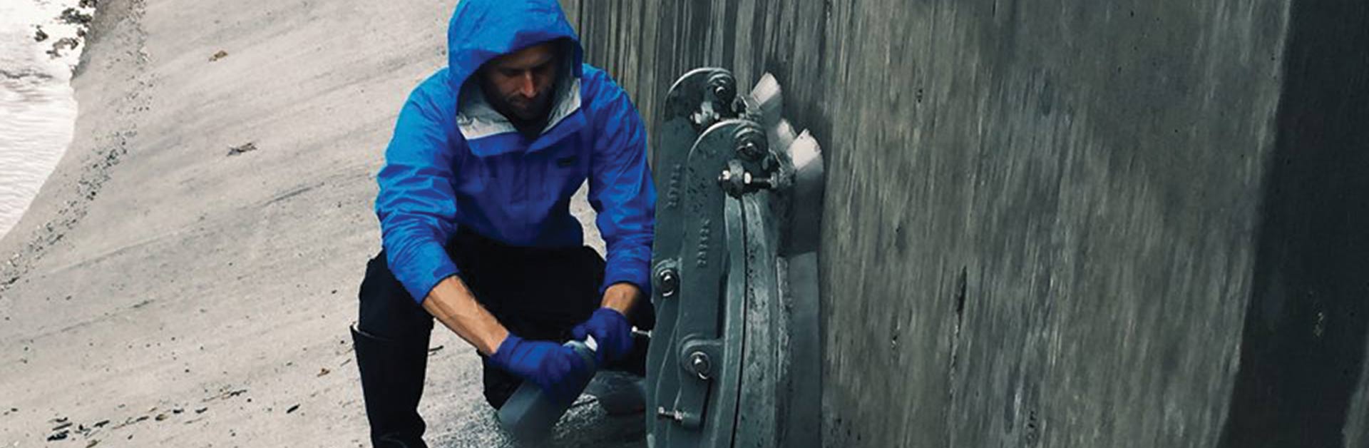 Close-up of Ben monitoring the storm drain polluted runoff.