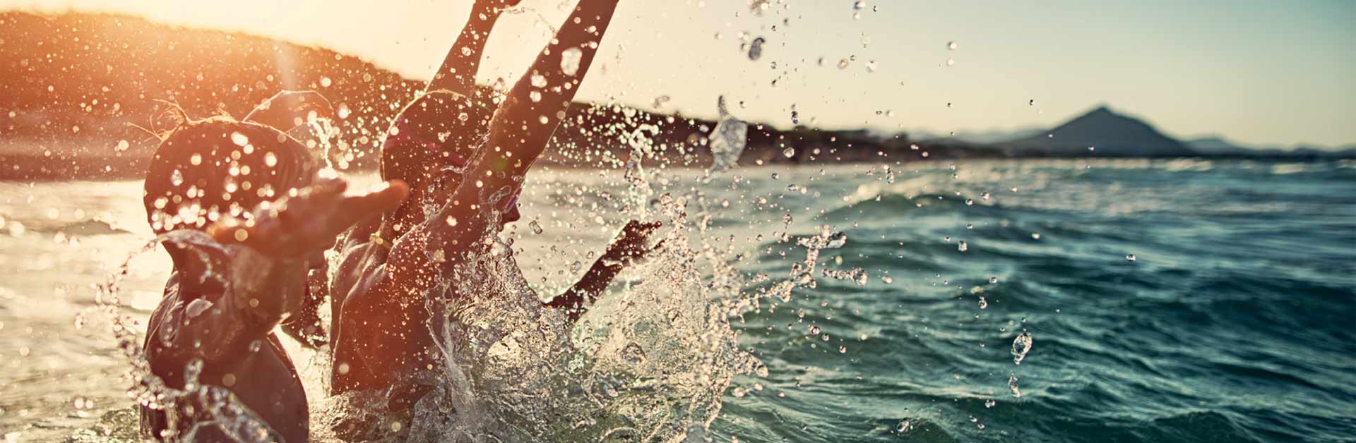 Happy swimmers in the ocean.